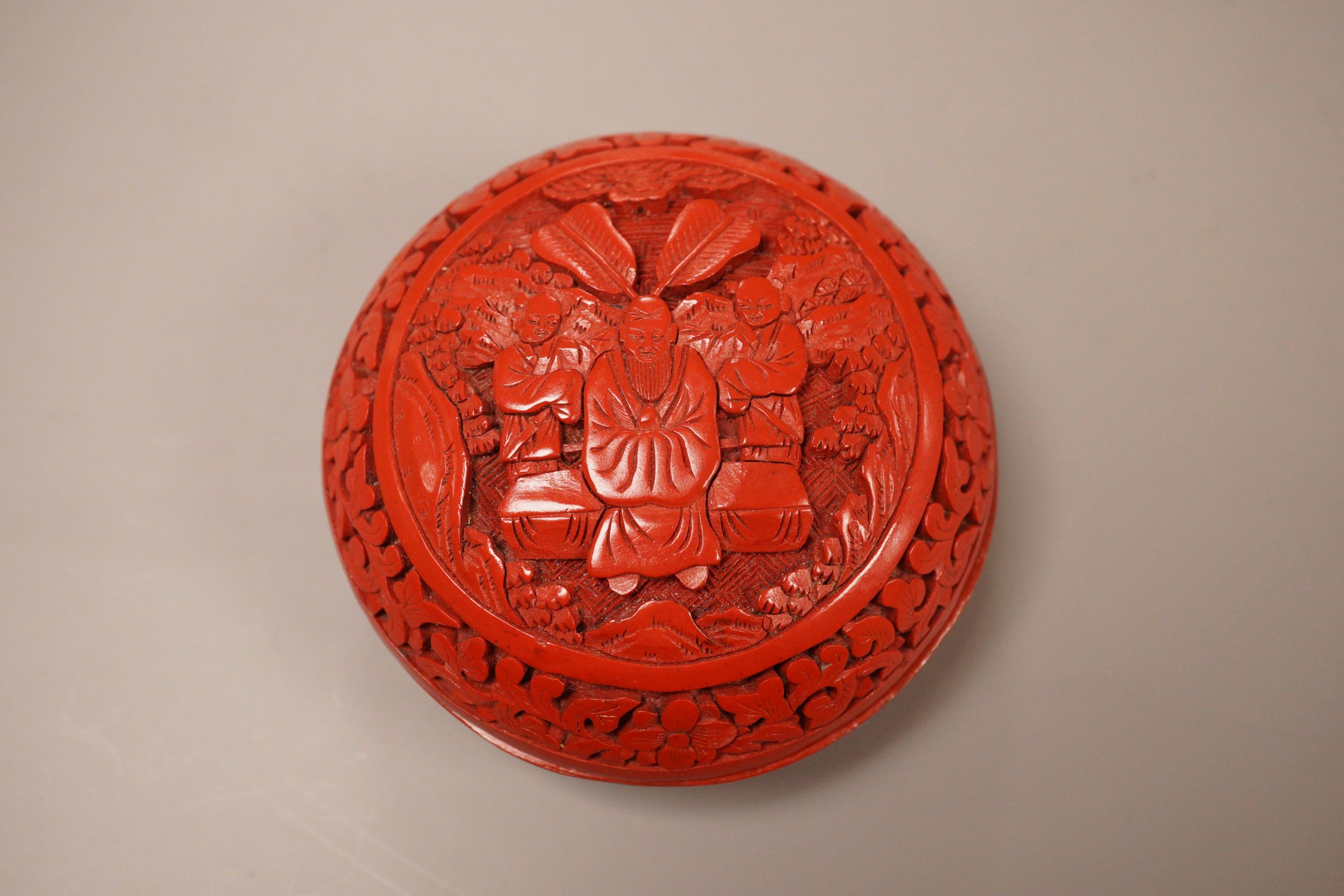 A Chinese cinnabar lacquer box, 8cm diameter